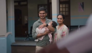 a person and person holding a baby for the Tata Tigor ad