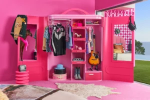 a pink room with a horse head and a closet in the Malibu dream house 
