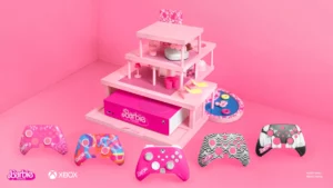 a barbie game system with a doll house and video game controllers
