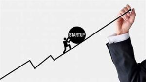 a person in a suit and tie holding a graph representing the upward growth of startups 